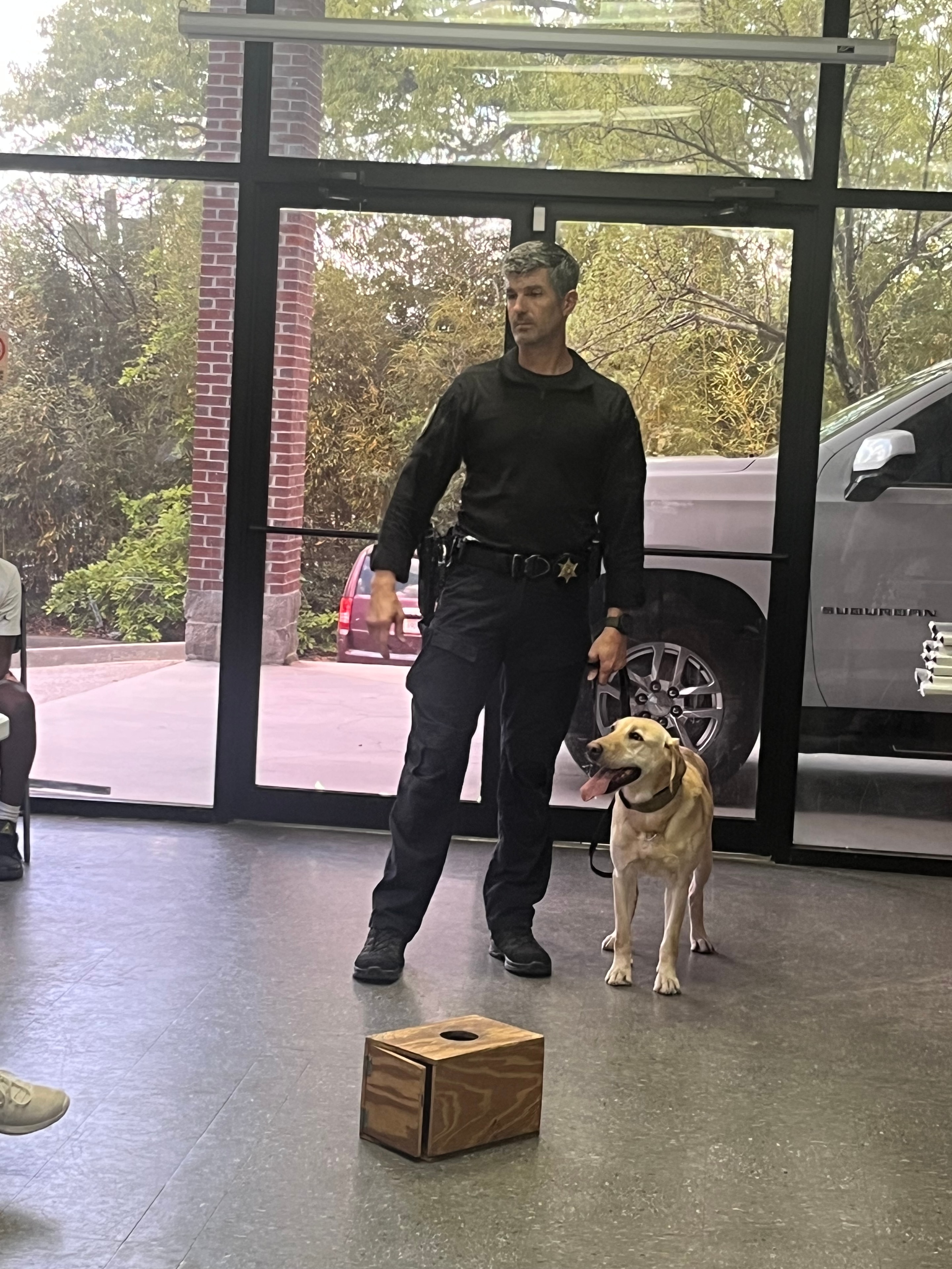 Deputy with K-9 officer and Richland County Sheriff flags